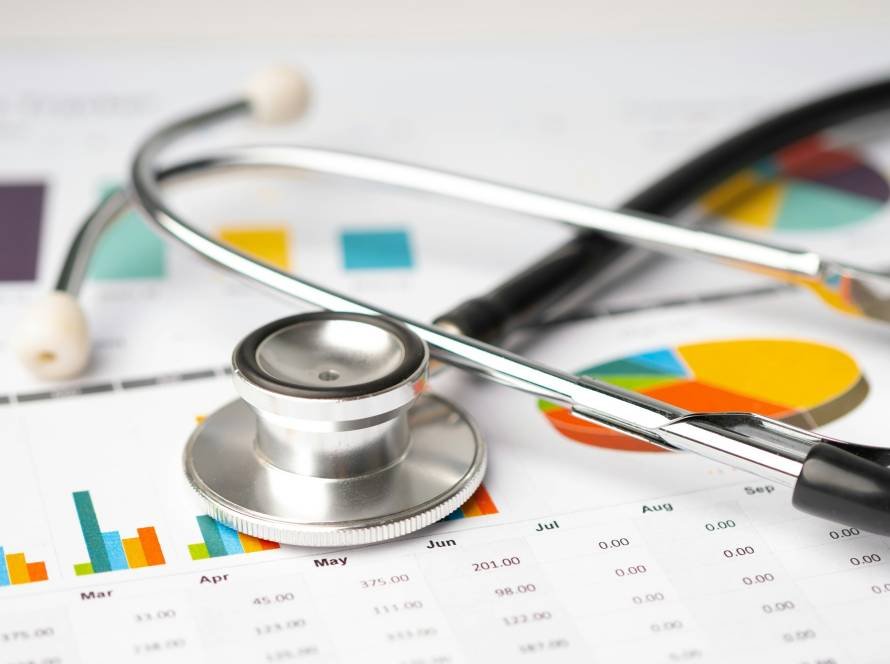 Stethoscope on chart graph paper, finance, account, statistic, analytic economy Business concept.