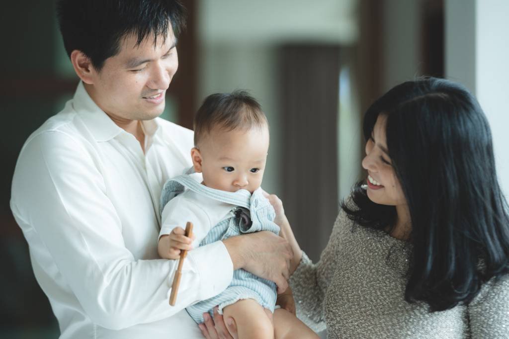 Healthcare Payer - VLMS Healthcare young Asian family are happy together at home by life insurance concept, child baby and mother